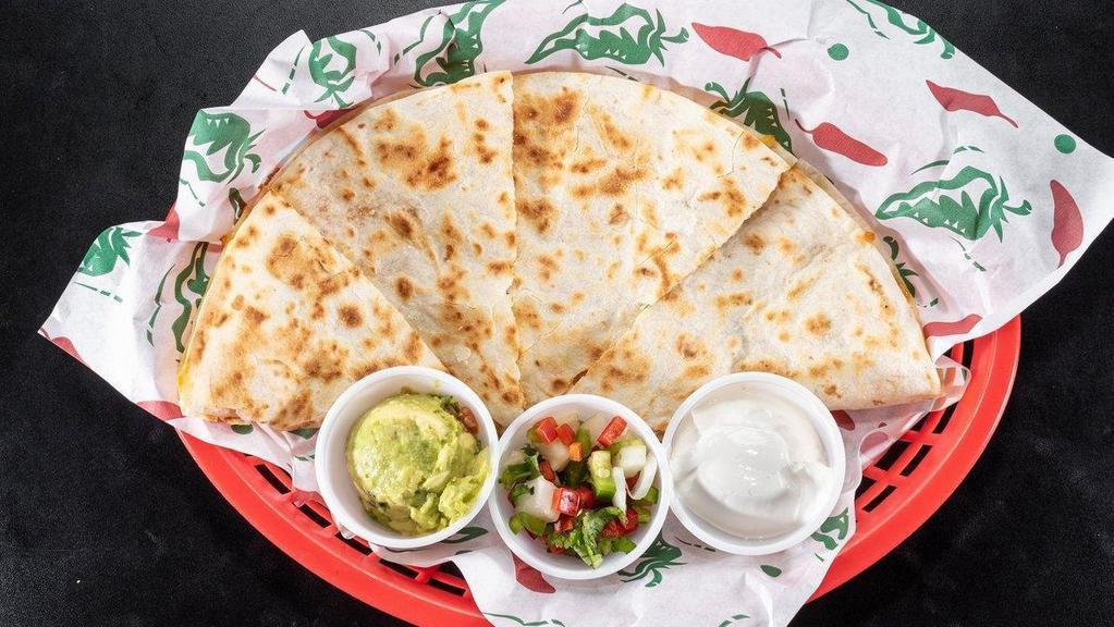 Quesadillas · A large flour tortilla lightly grilled with mixed cheese and garnished with a side of sour cream, guacamole, and pico de gallo.