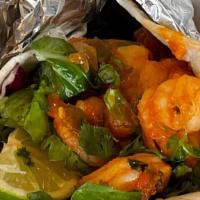 Spicy Grilled Shrimp Taco · Spicy grilled shrimp tossed in homemade Tapatio aioli topped with cilantro, salad mix, and a...