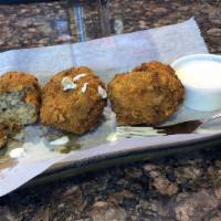Boudin Balls · Three large boudin balls rolled in cracker crumbs and deep-fried.