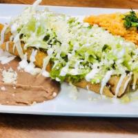 Flautas Mixtas · Three thin corn tortillas filled with deshebrada, chicken, and papas con chorizo topped with...