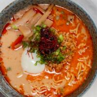Spicy Miso · Minced pork, poached egg, bamboo, scallion, spicy rayu, and chili threads.