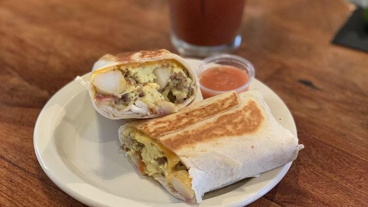 Breakfast Burrito · Flour tortilla, eggs, potatoes, cheddar and your choice of bacon, breakfast sausage or chorizo.