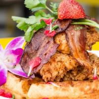 Fried Chicken & Waffles · Fried chicken and bacon over our house waffles with bourbon maple syrup and butter.