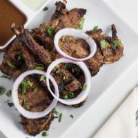 Colachi Masala Chops · Tender chops marinated in a rich mixture of spices and herbs, barbequed to perfection.
