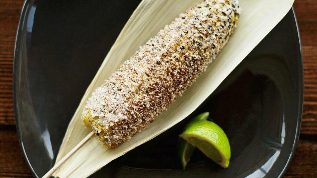 Elote Especial · Roasted corn with mayo, cotija cheese, house made chili powder, lime