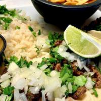 3 Street Tacos.. · Beef carne asada or pork al pastor topped with cilantro, diced onion, and salsa