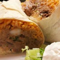 Burrito · Flour tortilla with Choice of Meat, Rice, Beans, Monterey Jack Cheese, Lettuce, Tomatoes, so...