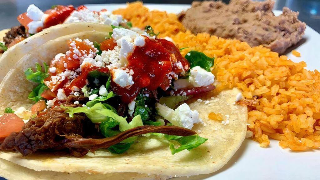 Taco Combo · Two Tacos served with your choice of Rice and Beans