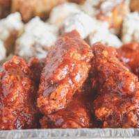 100 Wings · 100 Bone-In or Boneless Wings (Choose up to 5 Flavors and includes choice of Dressing)