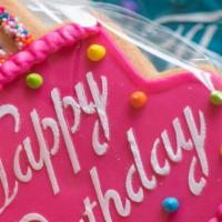 Happy Birthday Cookie · decorated 'happy birthday' cookie shaped like a birthday cake in a clear cellophane bag with...