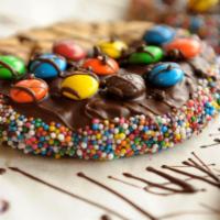 Monster Cookie · giant chocolate chip cookie dipped in dark chocolate, covered with M&M's & sprinkles