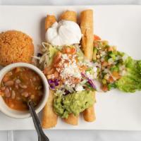 Flautas · (3) crispy fried corn tortilla filled with shredded chicken served with lettuce, guacamole, ...