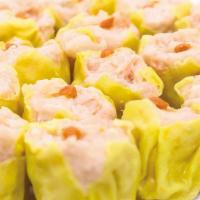 Shu Mai · Steamed dumplings, chicken and pork, carrots, celery, onion serve with ginger sauce