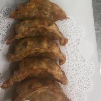 Pot Sticker (Chicken) · Fried dumplings serve with ginger sauce