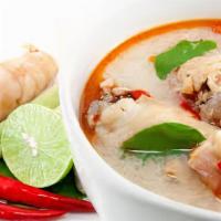 Tom Kha Chicken 32Oz · Chicken in spicy broth with coconut milk, lemongrass galangal root, kaffir lime leaves, lime...