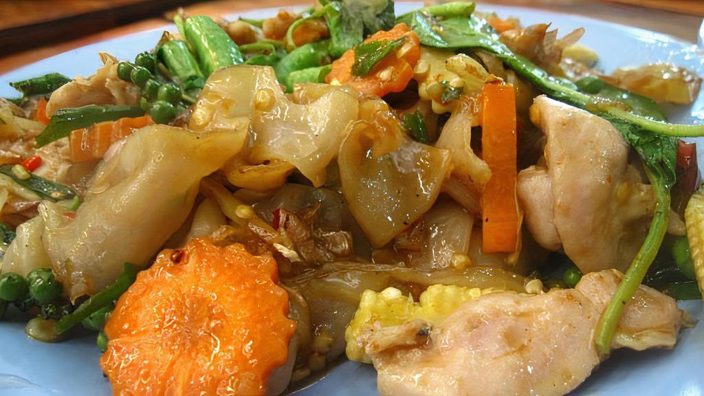 Pad See-Ew · Choice of Meat Chicken , Pork, Beef, Tofu or Mix Veggies wide rice noodles sautéed with broccoli carrots and egg with sweet soybean sauce