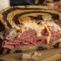 Raquel Sandwich · Hot Turkey Pastrami Sandwich on Grilled Black Bread with Creamy Coleslaw, Melted Swiss, and ...