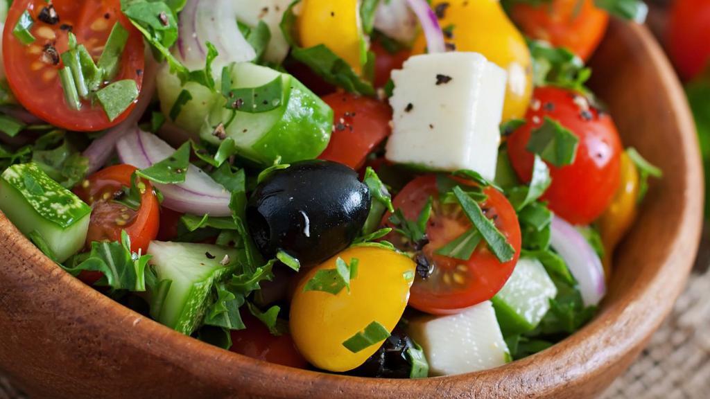 Greek Salad With Tzatziki · Delicious Romaine Lettuce Salad with Onion, Chopped Tomato, Cucumber, Pepperoncini, Feta, Greek Olive, Pita Chips, Greek dressing and Tzatziki.