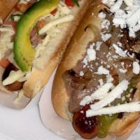 Hot Dog El Ranchero · Con Tocino, Frijol, Queso Fresco y Salsa. / Bacon Wrapped with Refried Beans, Mexican Cheese...