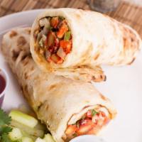Chicken Wrap (Desi Style) · Spicy version of our classic wrap mixed with tomatoes, onions, cilantro & green chilli's. Al...