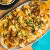 Loaded Chicken & Beer Cheese Fries · Fries topped with boneless chicken wings, shiner beer cheese, bacon, green onions, and homem...