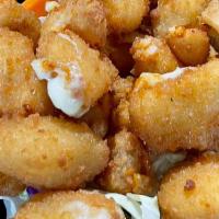 Cheese Curds · Chunks of mozzarella cheese lightly battered and fried. Served with a side of marinara.