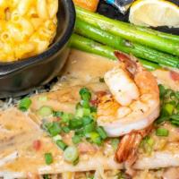 Bayou Redfish With 2 Sides · Redfish fillet blackened and topped with a spicy andouille cream sauce and two shrimp over a...