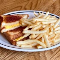 Kid Grilled Cheese · Grilled cheese sandwich served with fries and ketchup