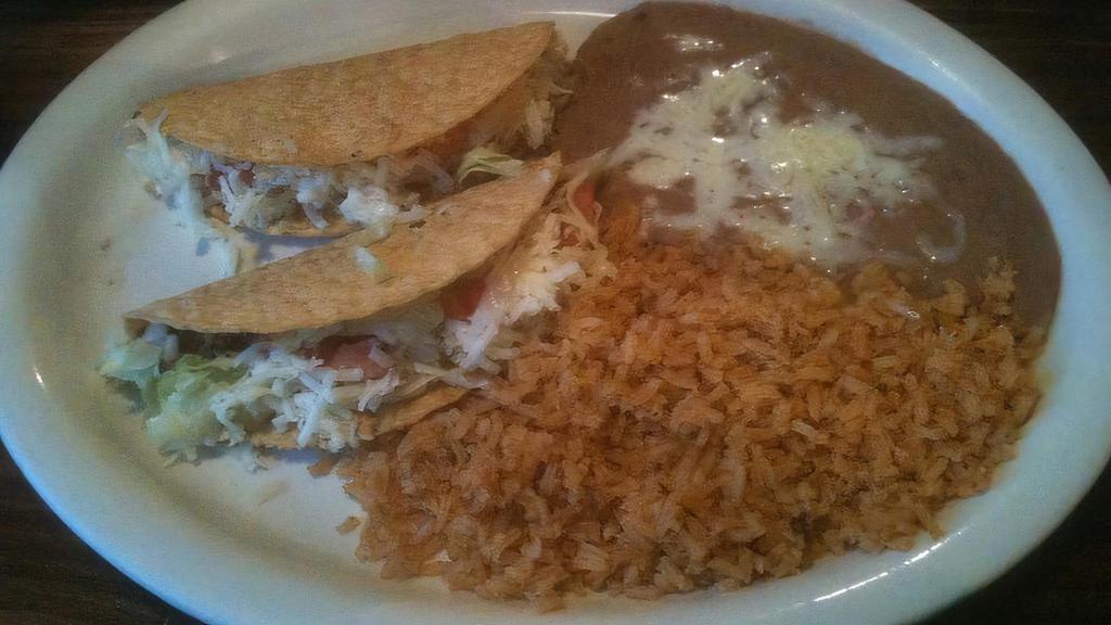 #1  · 1 Taco, 2 Enchiladas with choice of rice or beans.