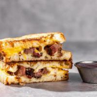 Cattleman'S Grilled Cheese · Juicy, smoked brisket, Muenster, Smoked Gouda & Yellow Cheddar on Rustic Bread. Served with ...