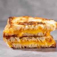 Rustic Grilled Cheese · Rustic white bread, smoked gouda, muenster and yellow cheddar. Gooey and simply delicious, j...