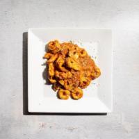 Tortellini Aldiamo · By Amoretto Italian. Tortellini pasta on pink amoretto sauce. Vegetarian. Contains gluten, d...