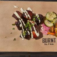 Pork Belly Burnt Ends 1/2 Lb · By Burnt BBQ & Tacos. Delicate pork belly slow smok'd to perfection then caramelized with or...