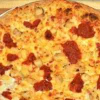 Chicken Parmesan Pizza · Extra marinara sauce, chicken breast and Parmesan cheese.