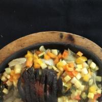 Fajitas De Vegetales · Portobello mushrooms, zucchini, squash, peppers & onions, stir-fried in a fajita marinade. G...
