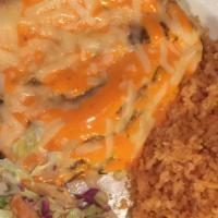 Pollo Chimiluigi · Orange cream atop a grilled chicken breast with melted cheese. Mexican rice, borracho beans ...