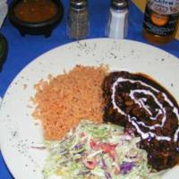 Puerco En Pasilla · Tender pieces of pork & thin sliced mushrooms in a rich pasilla pepper sauce. Mexican rice, ...