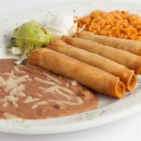 Flautas · Crispy rolled corn tortillas, w/ shredded chicken topped w/ sour cream & garnished with guac...