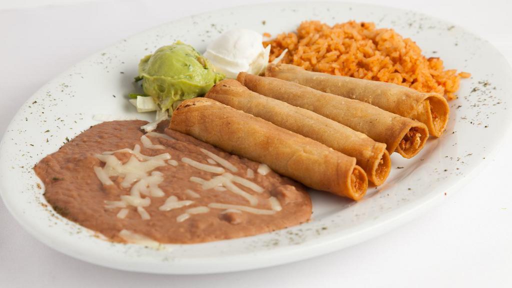 Flautas · Crispy rolled corn tortillas, w/ shredded chicken topped w/ sour cream & garnished with guacamole. Served with mexican rice & beans.