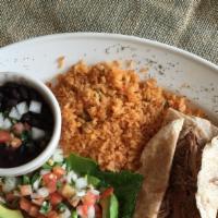 Brisket Tacos · Two soft corn or flour tortillas with slow cooked beef brisket. Black beans, mexican rice, p...