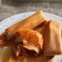Tamales En Chilorio · Fresh homemade tamales, stuffed with seasoned pork, smothered with our chile con carne sauce...