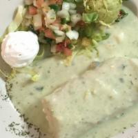 Chimichanga From The Grill · A large flour tortilla filled with beef or chicken fajita meat, cheese, poblano peppers & on...