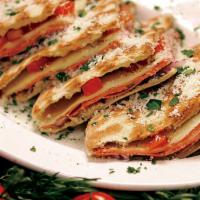 Italian Deli Sandwich · Prosciutto, soppressata di salami, mortadella ham, provolone cheese, romaine lettuce, red on...