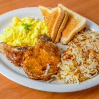 Pork Chop And Eggs · Thick juicy  grilled pork chop  served with 2 eggs any style, hash browns and toast