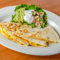 Breakfast Quesadilla · Flour tortilla filled with scrambled eggs, your choice of meat, topped with cheese.