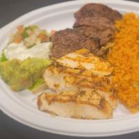 Steak Or  Chicken Fajitas · Served with Rice and Beans over sautéed Bell peppers  and onions, on the side guacamole, sou...