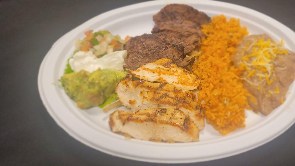 Steak Or  Chicken Fajitas · Served with Rice and Beans over sautéed Bell peppers  and onions, on the side guacamole, sour cream  pico de gallo and flour tortillas. Make it a combo!!!