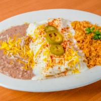 Enchiladas - Chicken With Sour Cream Sauce, Rice & Beans · Corn tortillas rolled with chicken and onions marinated in tomatillo sauce, Topped with our ...