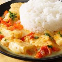 Conga Fish · Fish fillet, mango sauce, salad and rice.