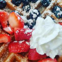 Belgium Waffle · Berries, whipped cream and powdered sugar